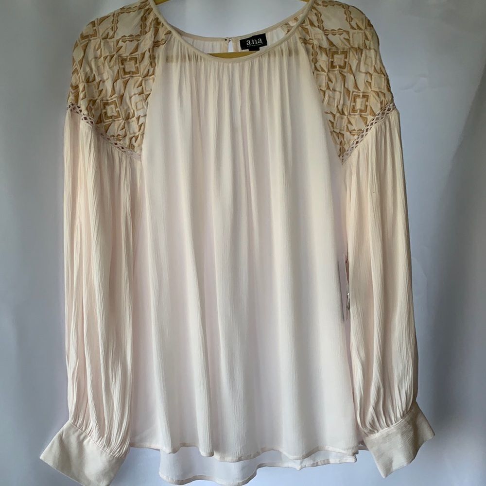 A.N.A. size large cream color top with tan detail at the shoulders.  Crepe like.